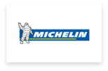 Michelin logo featuring the Michelin Man and brand name on a blue background.