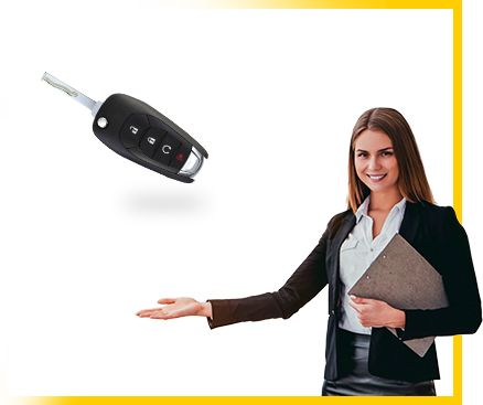 Businesswoman presenting a car key, smiling, and holding a folder, emphasizing automotive sales.